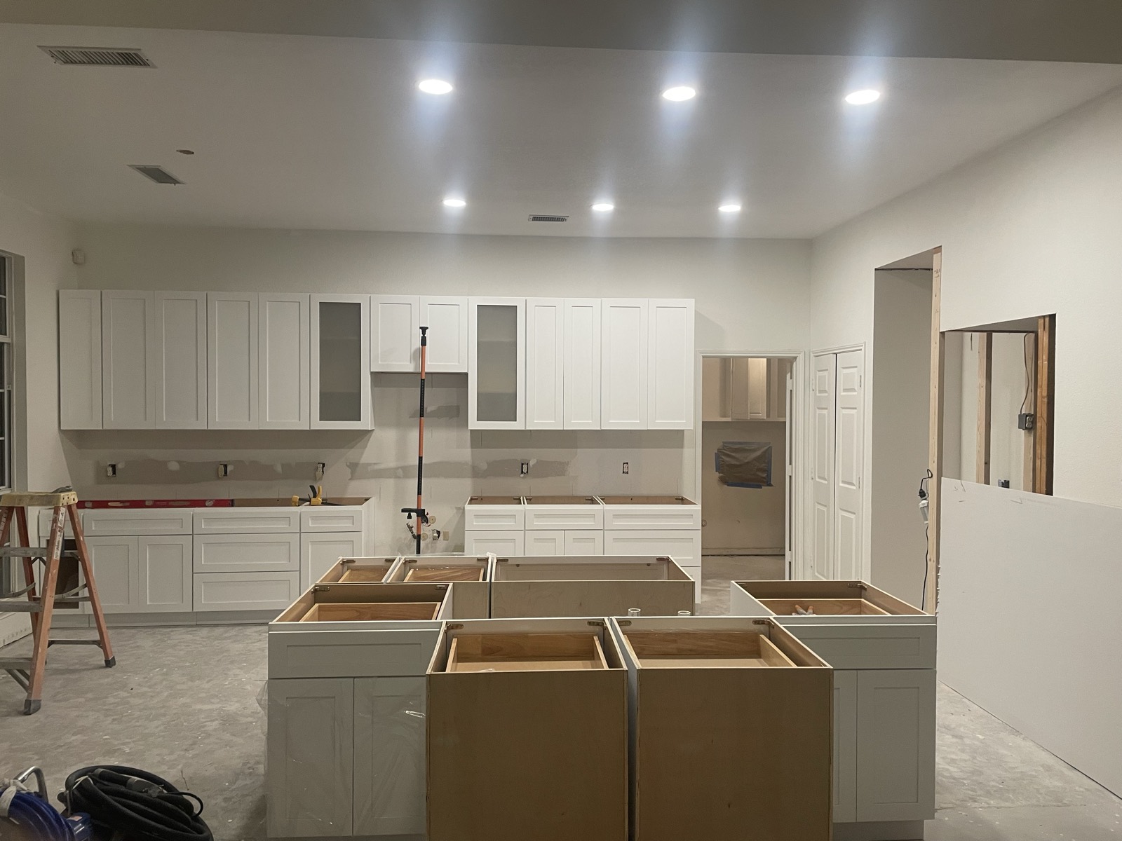 New white shaker cabinets installed and island bases being set