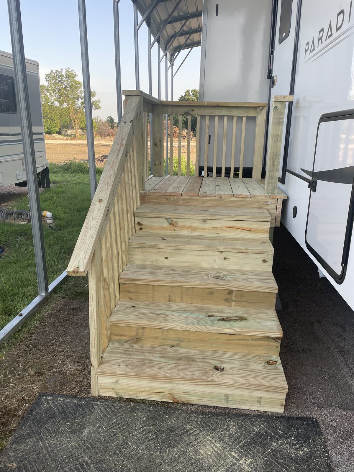 Custom-built wood staircase with landing and railing